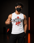 A man wearing a white sleeveless tank top with a red and black 'CHEST UP' graphic, paired with black athletic pants, standing in a dark gym setting and pointing to the chest graphic.