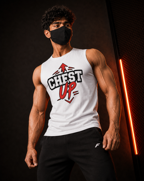 A muscular man wearing a white sleeveless tank top with a red and black 'CHEST UP' graphic, paired with black sweatpants and a black face mask, standing against a dark background with a vertical orange neon light.